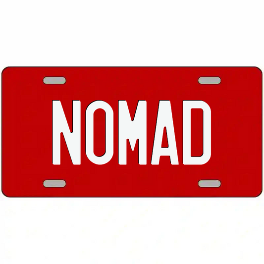 Nomad White on Red Metal Sign